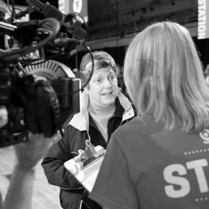 A person talking to a member of the press