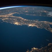 An image from outer-space at night showing the lights in Italy