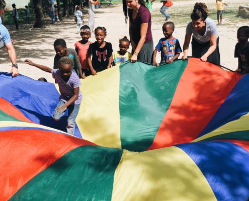 Children Playing with a parachute in Haiti