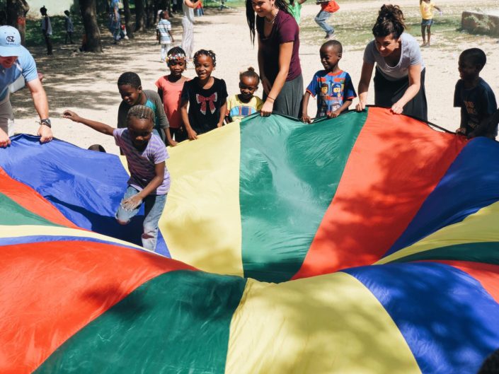 Children Playing with a parachute in Haiti