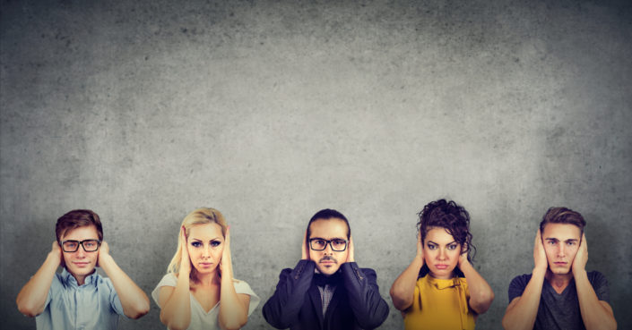 group of diverse people covering their ears