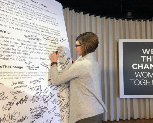 CEO of Mission Partners, Carrie Fox signing the WeTheChange declaration