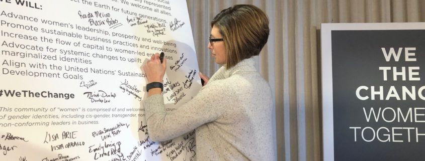 CEO of Mission Partners, Carrie Fox signing the WeTheChange declaration