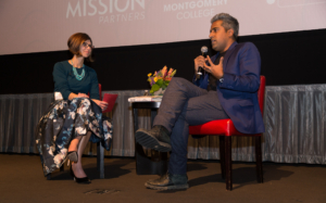 Carrie Fox interviewing author Anand Giridharadas on stage