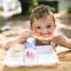 young boy eating a watermelon slice