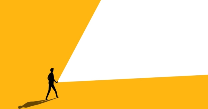 a person shines a white light flashlight